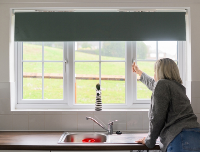 A tenant opening their window