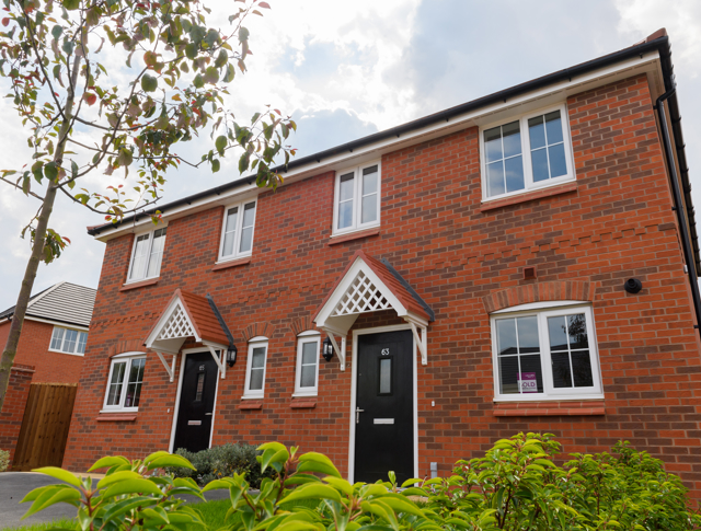 Looking up at 2 newly built homes