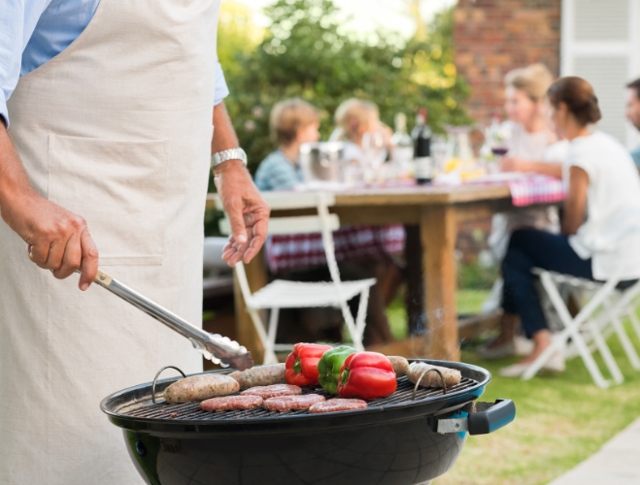 A person cooking on a barbecue