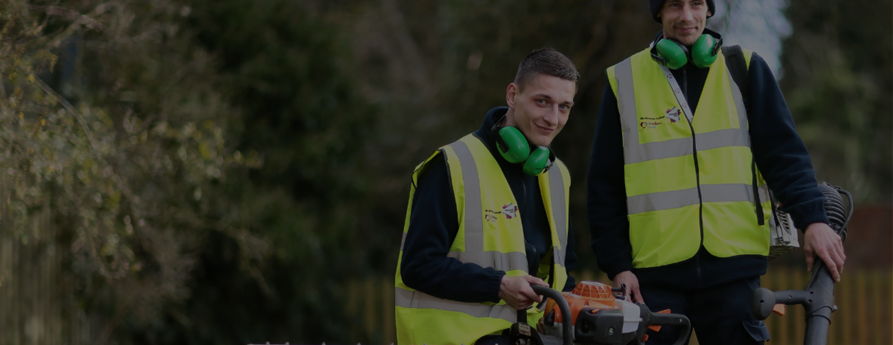 2 men with high visibility jackets and protective ear defenders