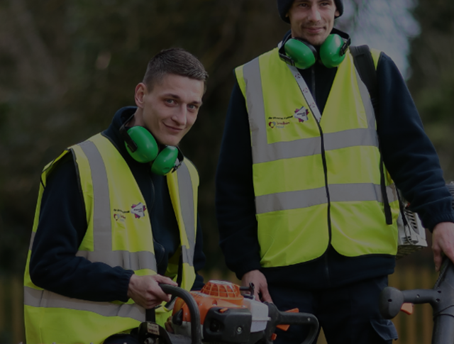 2 men with high visibility jackets and protective ear defenders