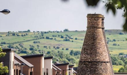 A beautiful view in Staffordshire with homes in the front and fields in the distance