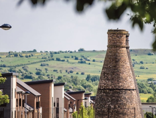 A beautiful view in Staffordshire with homes in the front and fields in the distance