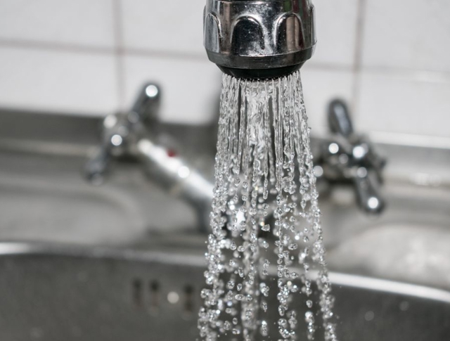 Water spraying out of a tap