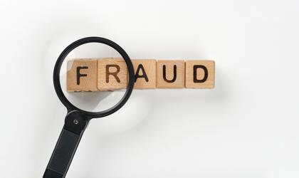 Magnifying Glass With Fraud Message