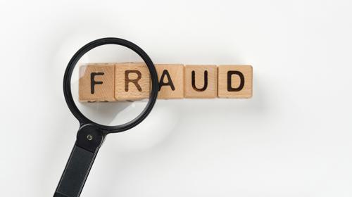 Magnifying Glass With Fraud Message