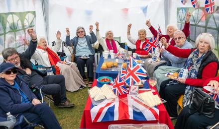 Residents Posing With Union Jack Flags 1