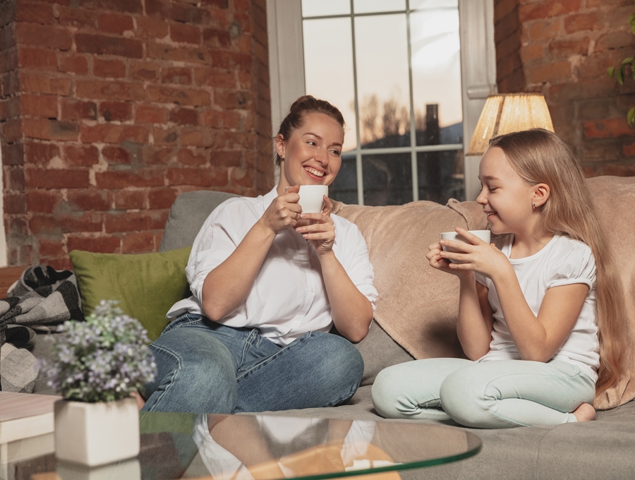 Mother and daughter drinking tea
