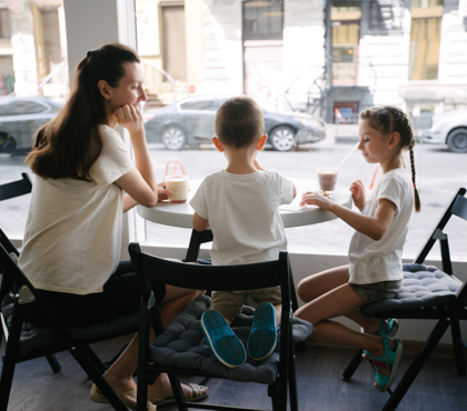 Mother In A Cafe With Her Son And Daughter Mother In A Cafe With Her Son And Daughter