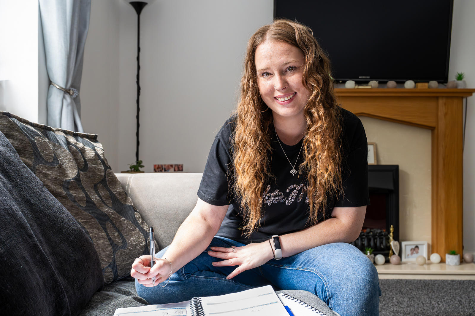 Woman Writing In A Large Notepad Handbook