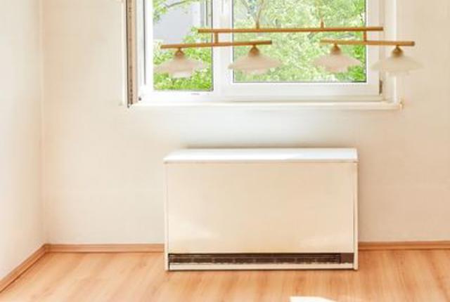 Storage heater in a bright, empty room