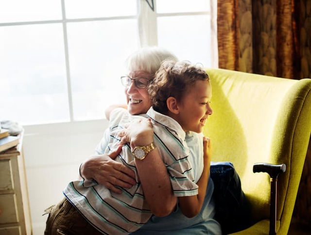 A grandma hugging her grandson