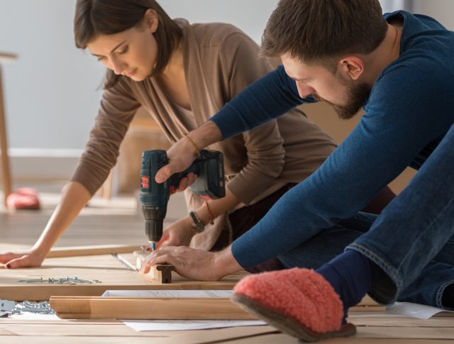 2 people carrying out home improvement work