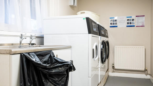 Sampson Close Laundry Area With Washing Machines