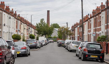 Oliver Street in Coventry, looking straight down the road with cars and houses either side