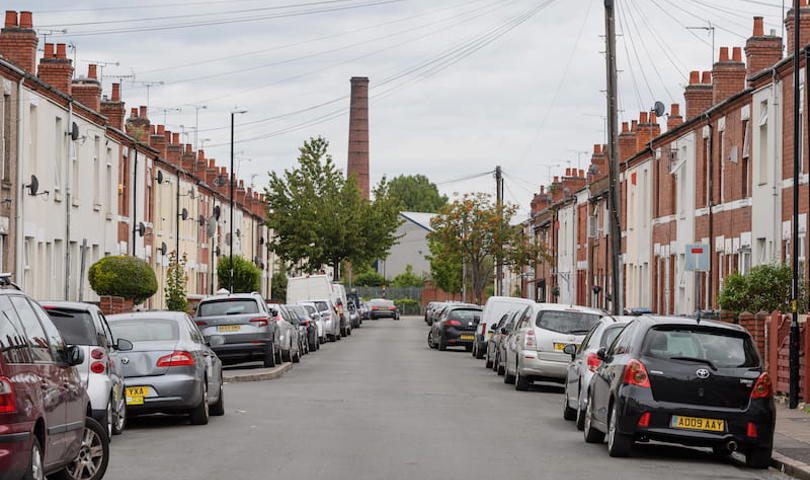 Oliver Street in Coventry, looking straight down the road with cars and houses either side