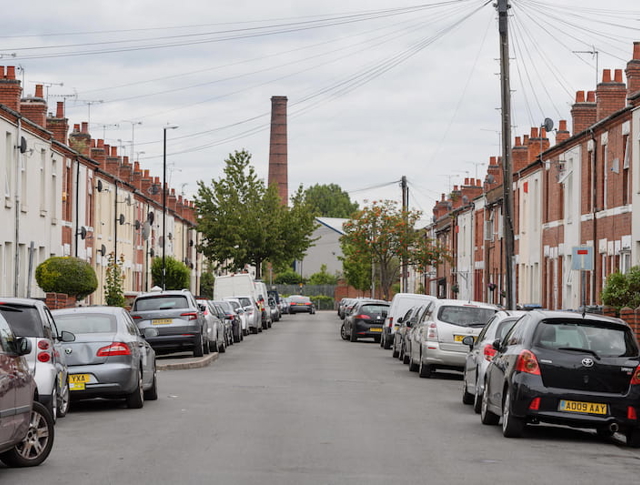 Oliver Street in Coventry, looking straight down the road with cars and houses either side