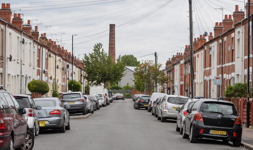 Oliver Street in Coventry, looking straight down the road with cars and houses either side
