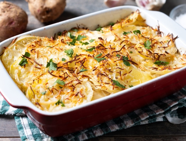 Close Up Photo Of A Homemade Shepherds Pie Sitting On A Cloth, Placed On A Wooden Table