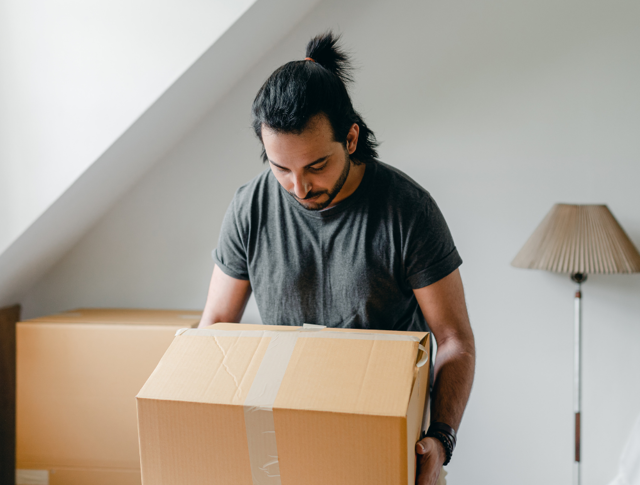 A man packing boxes