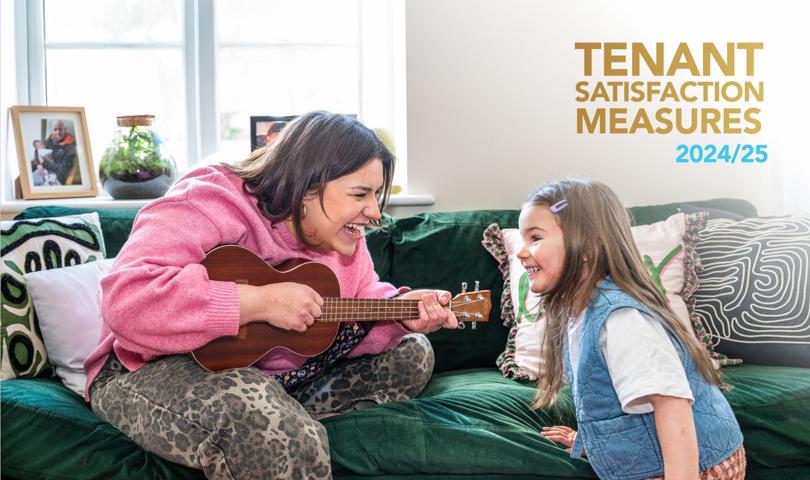 Photo Of Woman Sitting On Sofa Playing A Guitar To A Young Girl Both Are Smiling