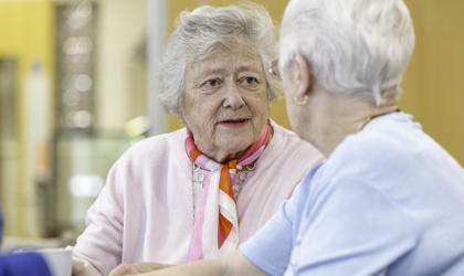 Two Elderly Women Speaking Together