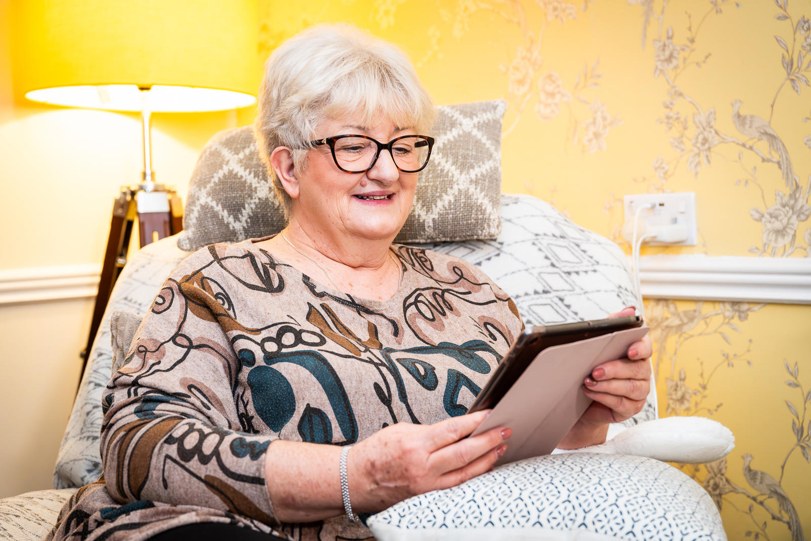 Tenant Looking At Her Tablet Making A Complaint