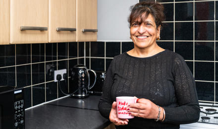 A Tenant Enjoying A Cup Of Tea In The Kitchen
