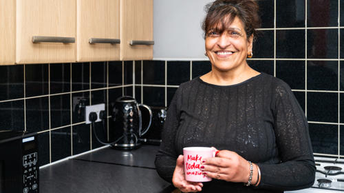 A Tenant Enjoying A Cup Of Tea In The Kitchen