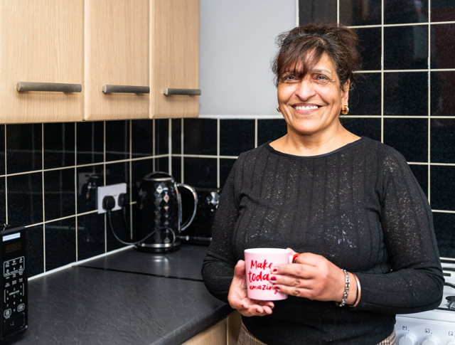 A Tenant Enjoying A Cup Of Tea In The Kitchen