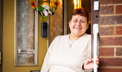 Woman Holding A Handrail At Her Front Door