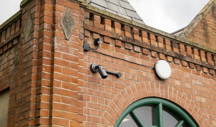 CCTV camera installed high on a wall