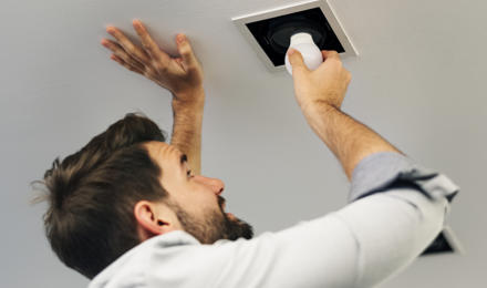 Man Changing Light Bulb